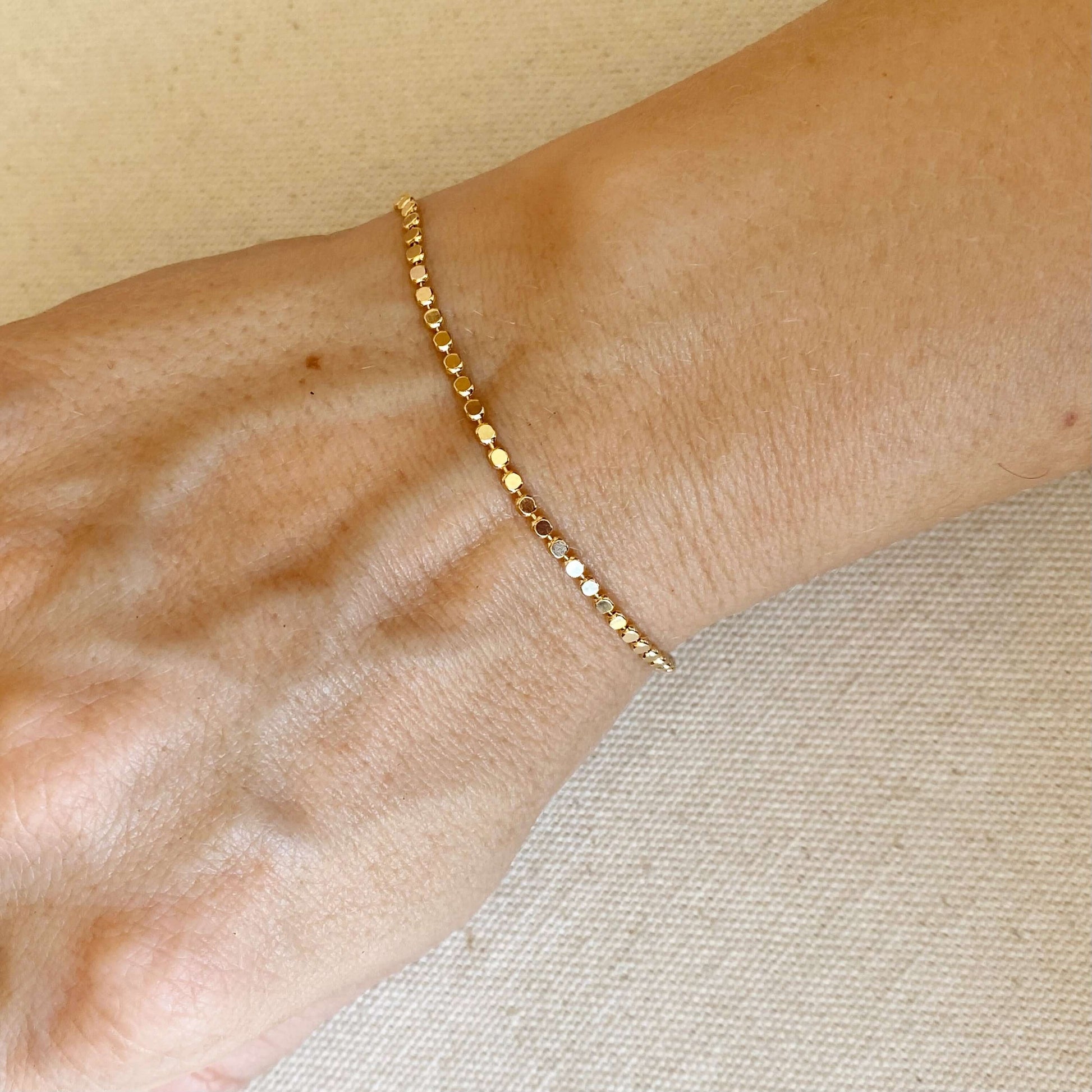 18k gold filled pebble bracelet on woman's wrist