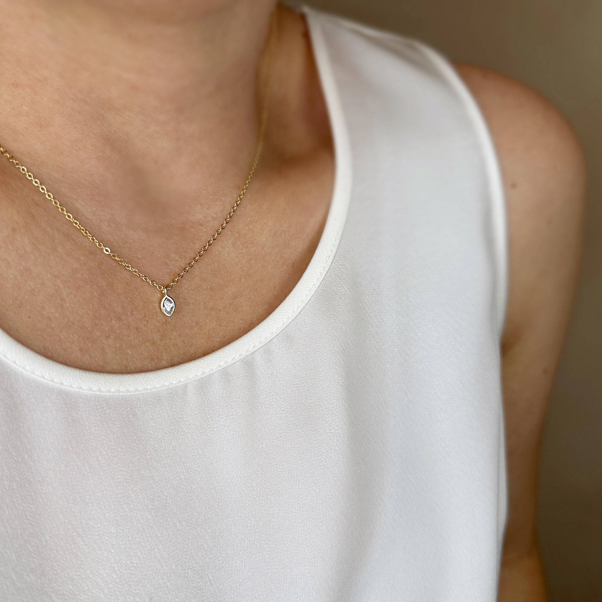 woman wearing 18K gold filled ellipse solitaire necklace