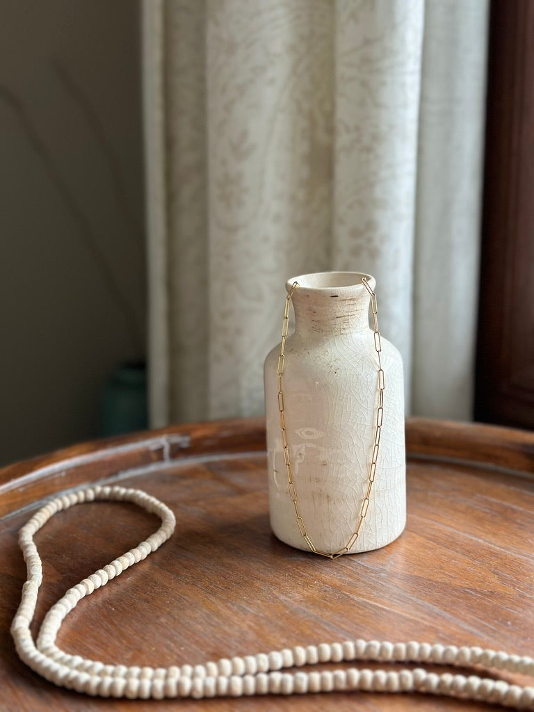 Gold Paperclip chain necklace shown on styled tray