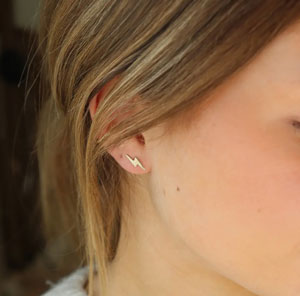 The cutest lightning bolt earrings! You need these 14k gold studs in your life.