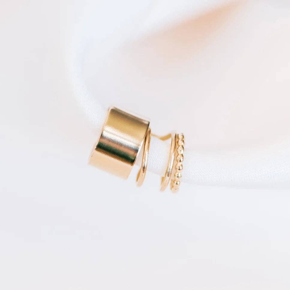 Double up ear cuff earrings in gold, shown next to other gold cuffs