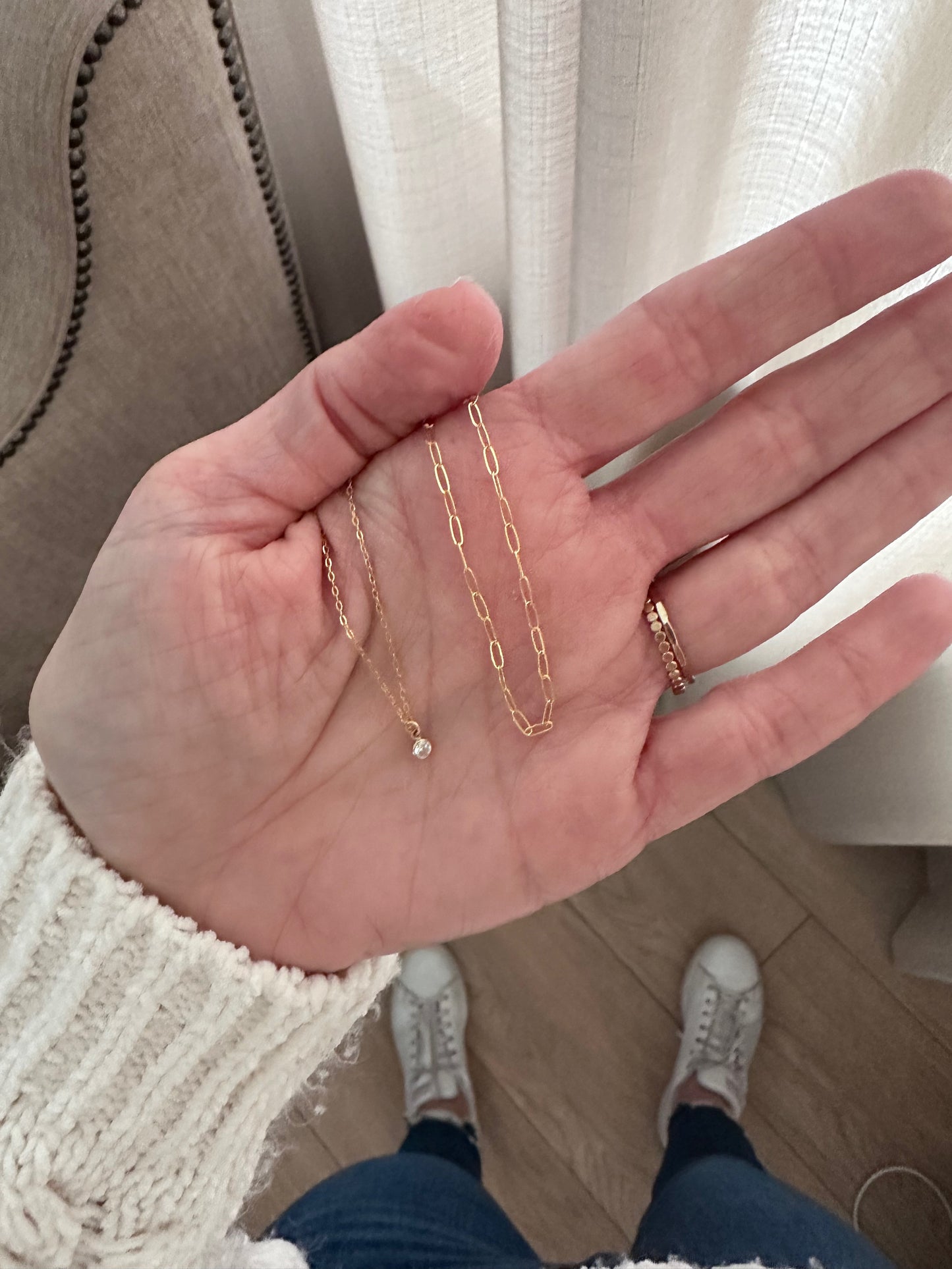 close up dainty mini paperclip chain necklace in 14K gold filled layered options