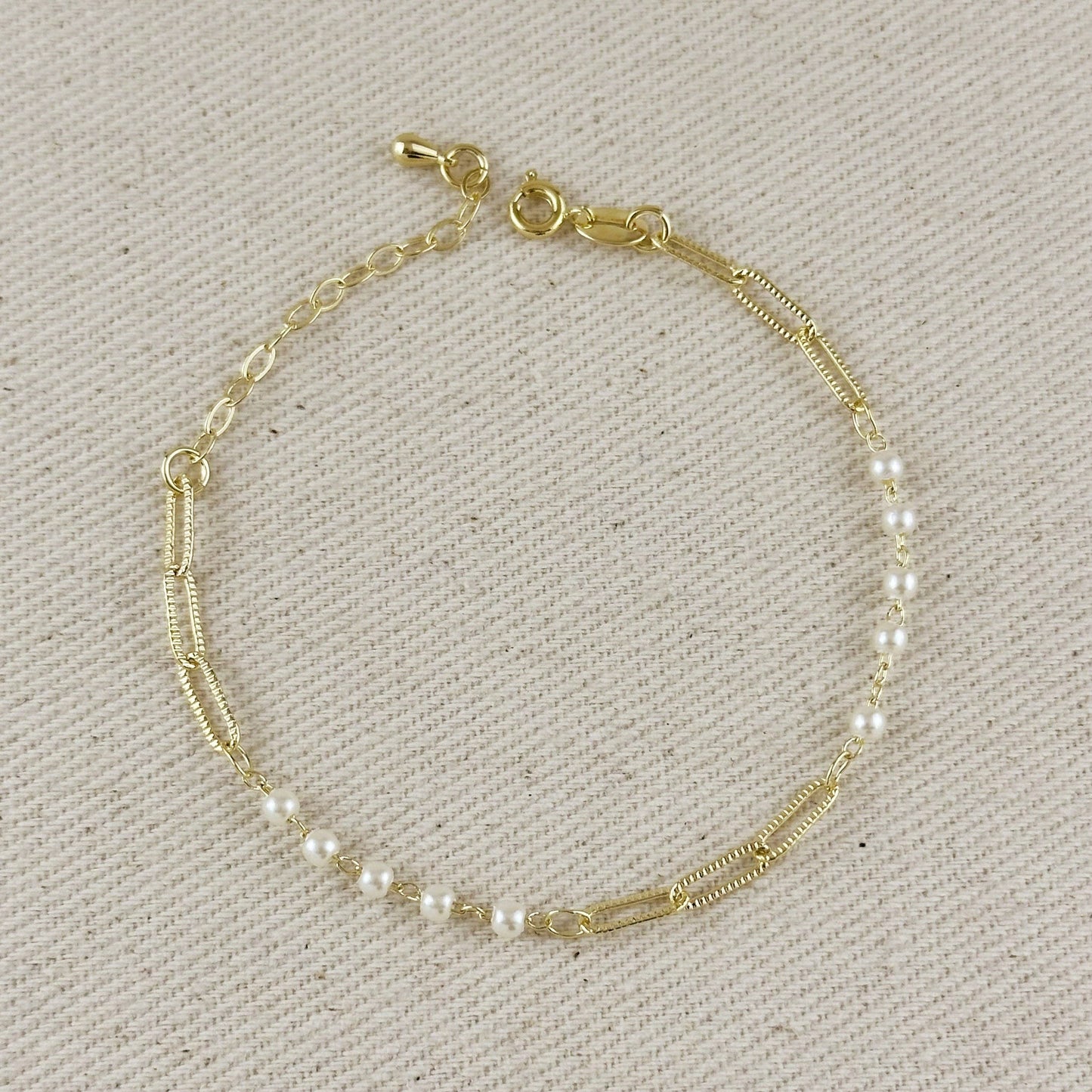 18K gold filled diamond cut paperclip and pearl bracelet close up