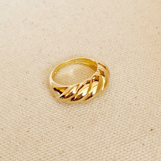 Dome croissant shaped ring in gold fill on textured background