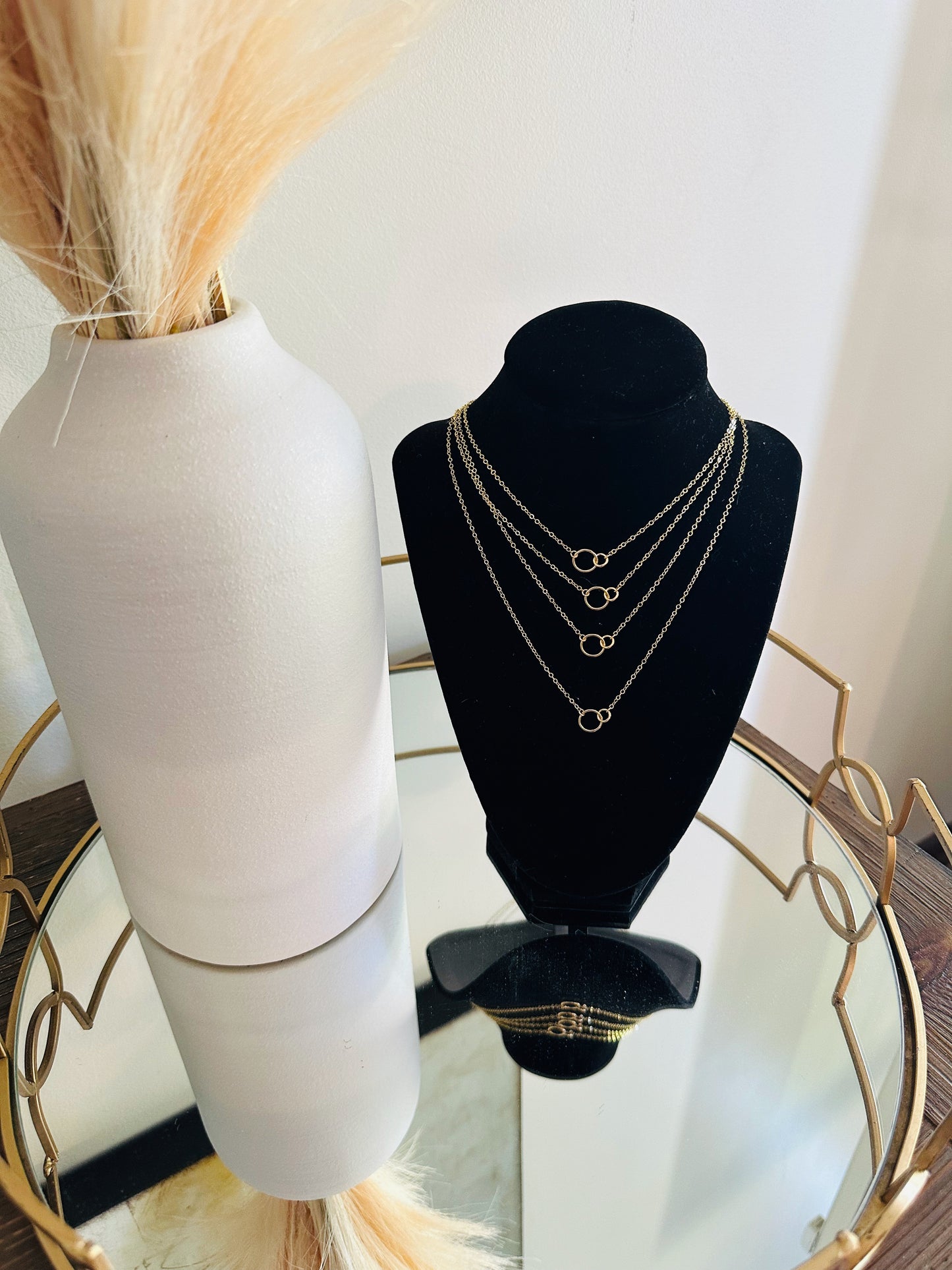 layered minimalist gold necklaces with tiny double circle pendant focal piece