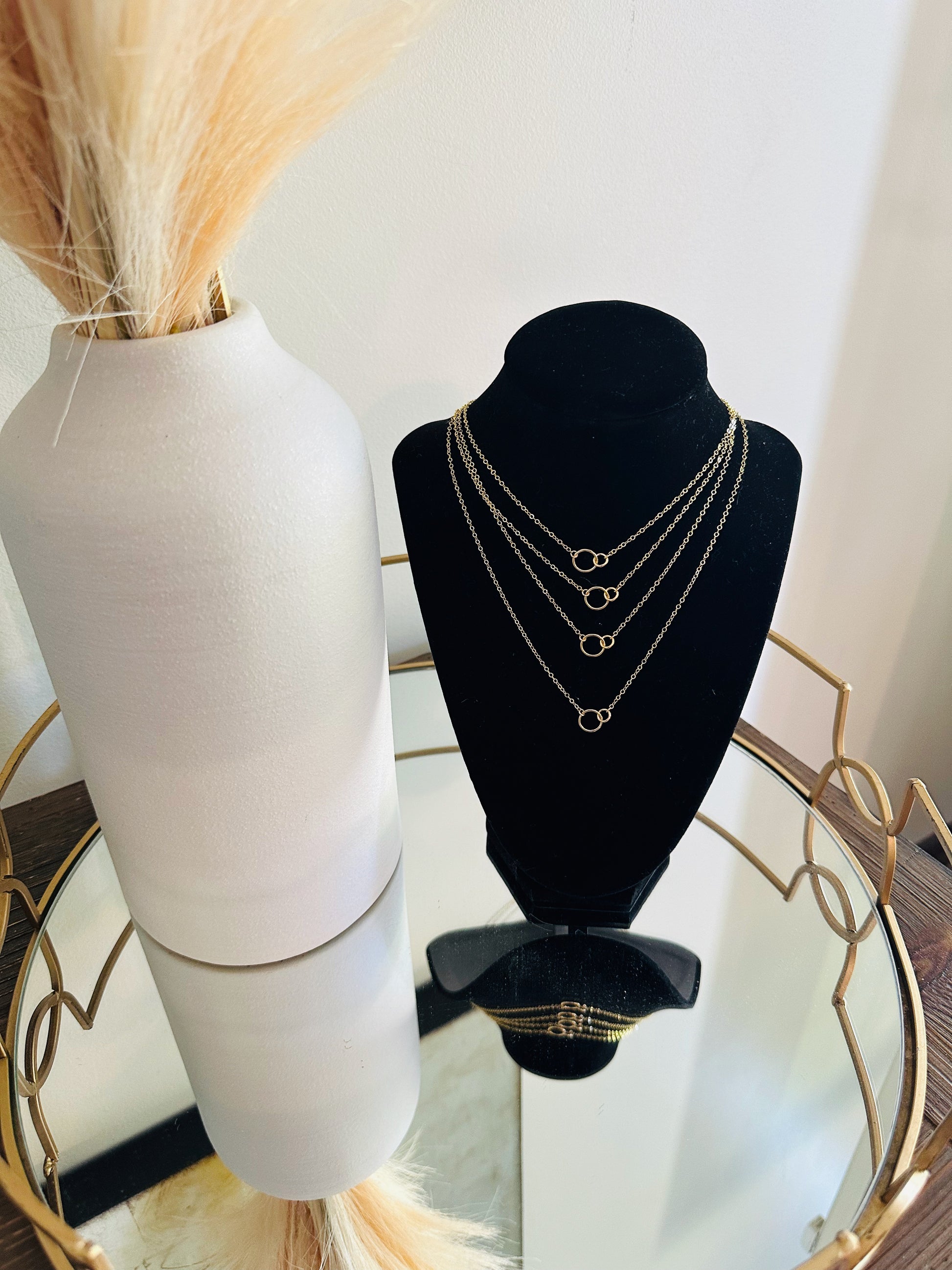 layered minimalist gold necklaces with tiny double circle pendant focal piece