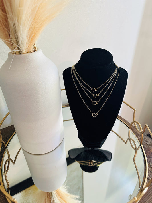 layered minimalist gold necklaces with tiny double circle pendant focal piece