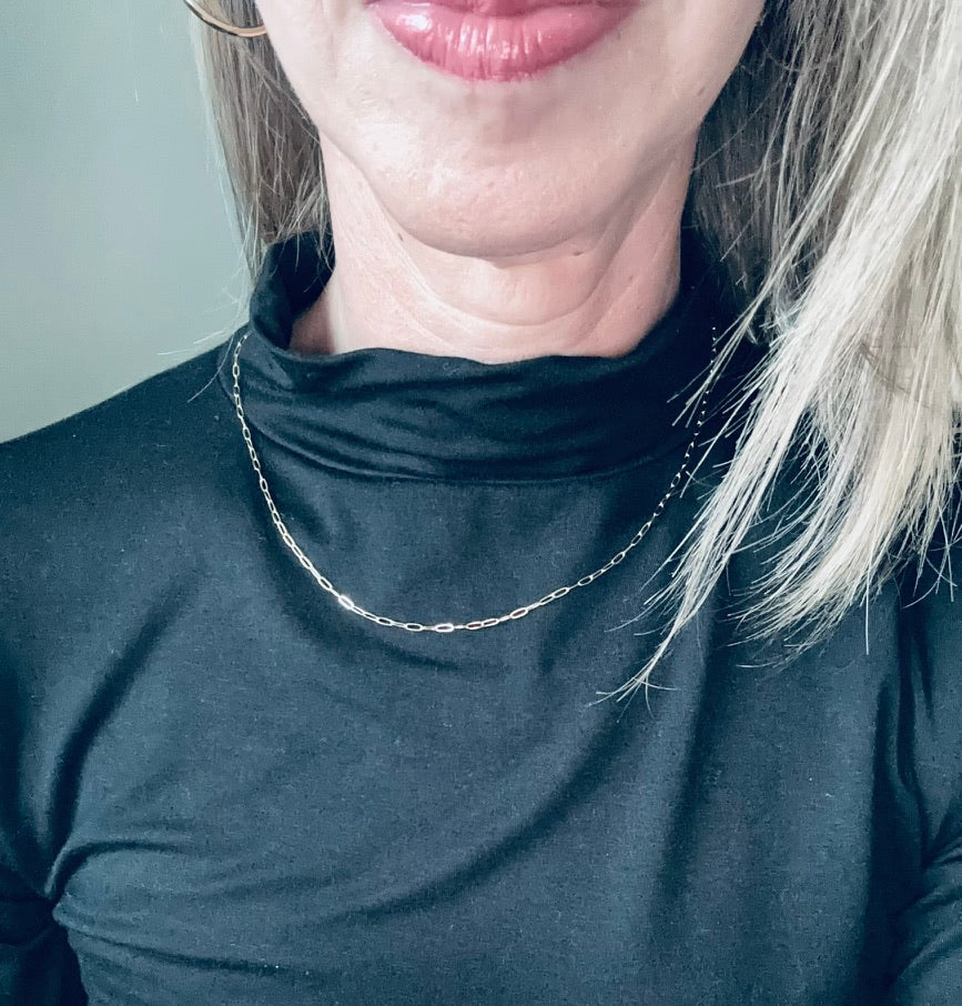 woman wearing the minimalist gold filled mini paperclip chain necklace