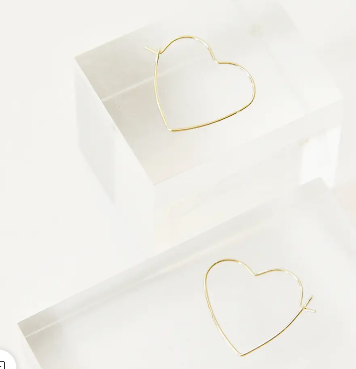 Heart shaped hoop earrings in gold and sterling silver