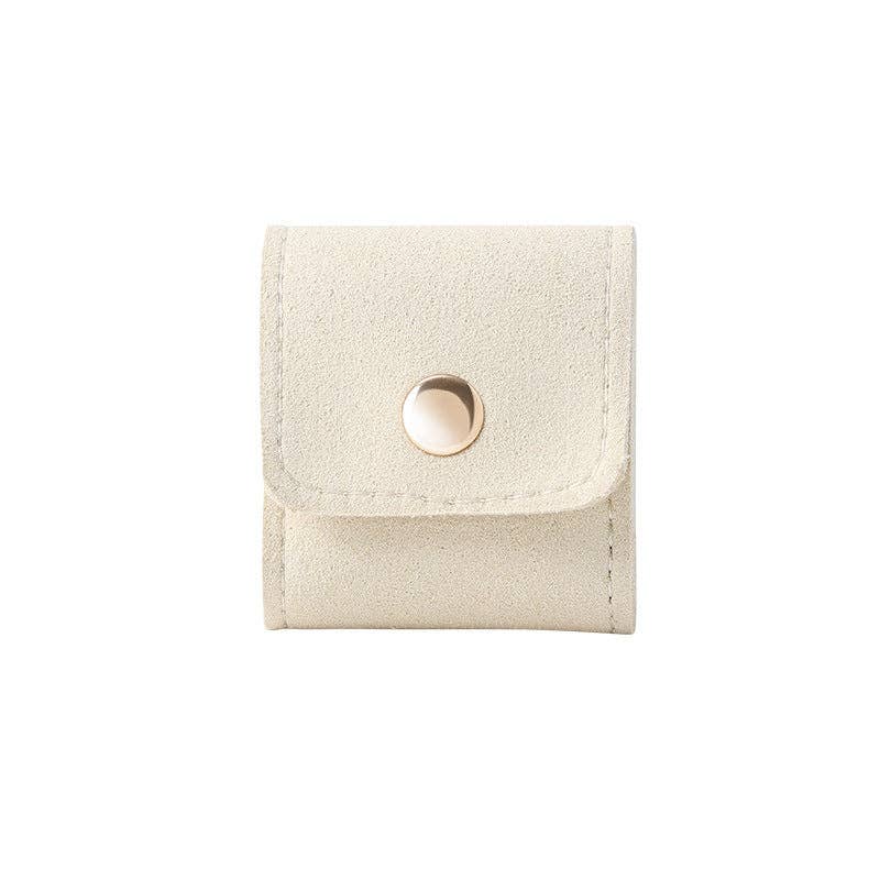 Leather travel jewelry pouch organizer in cream color and gold button