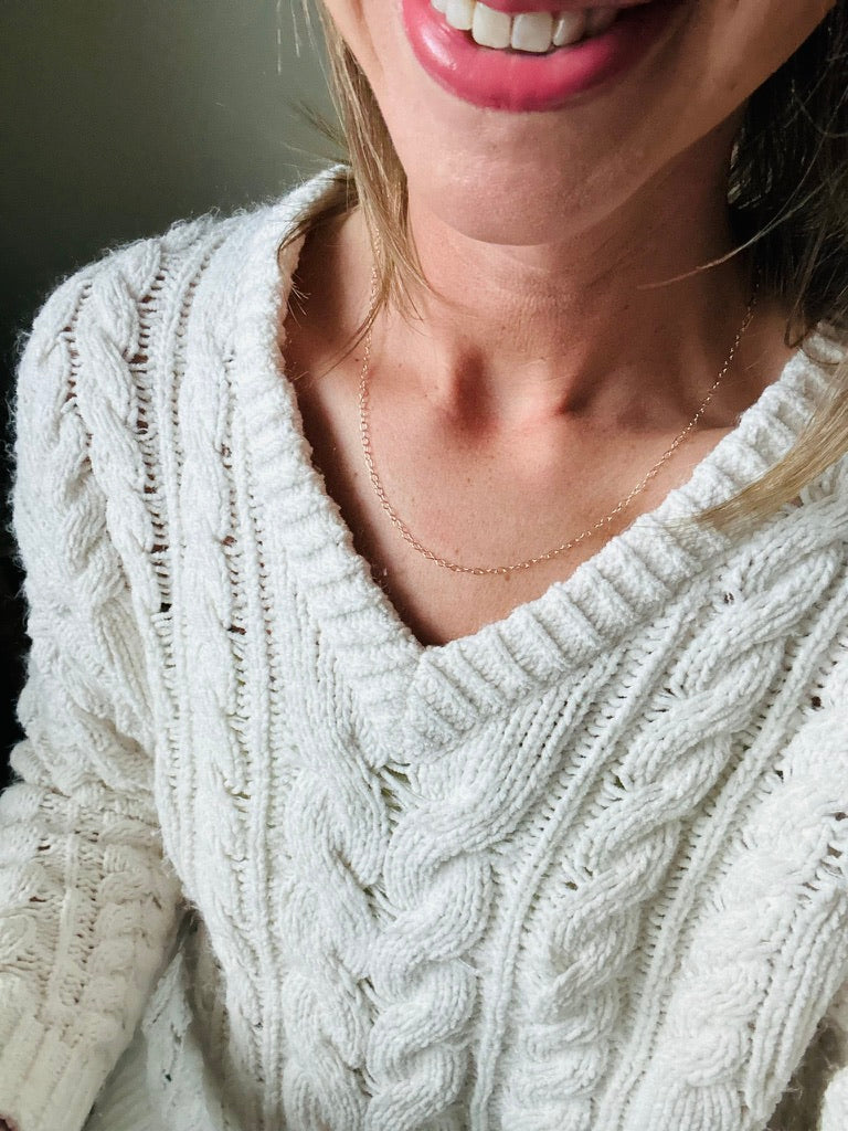 woman wearing minimalist oval cable chain necklace in gold filled finish
