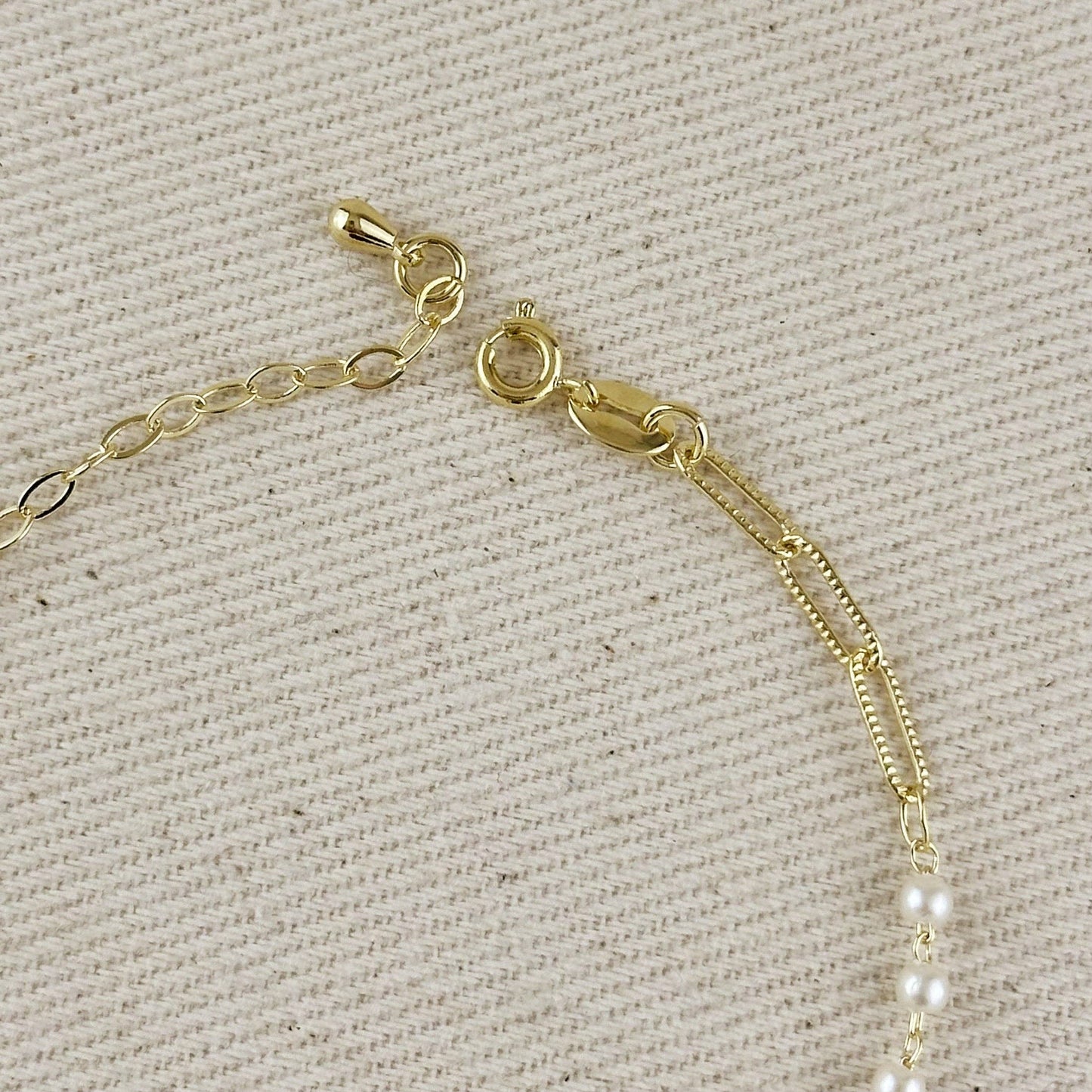 adjustable pearl and paperclip bracelet with extender chain detail and clasp