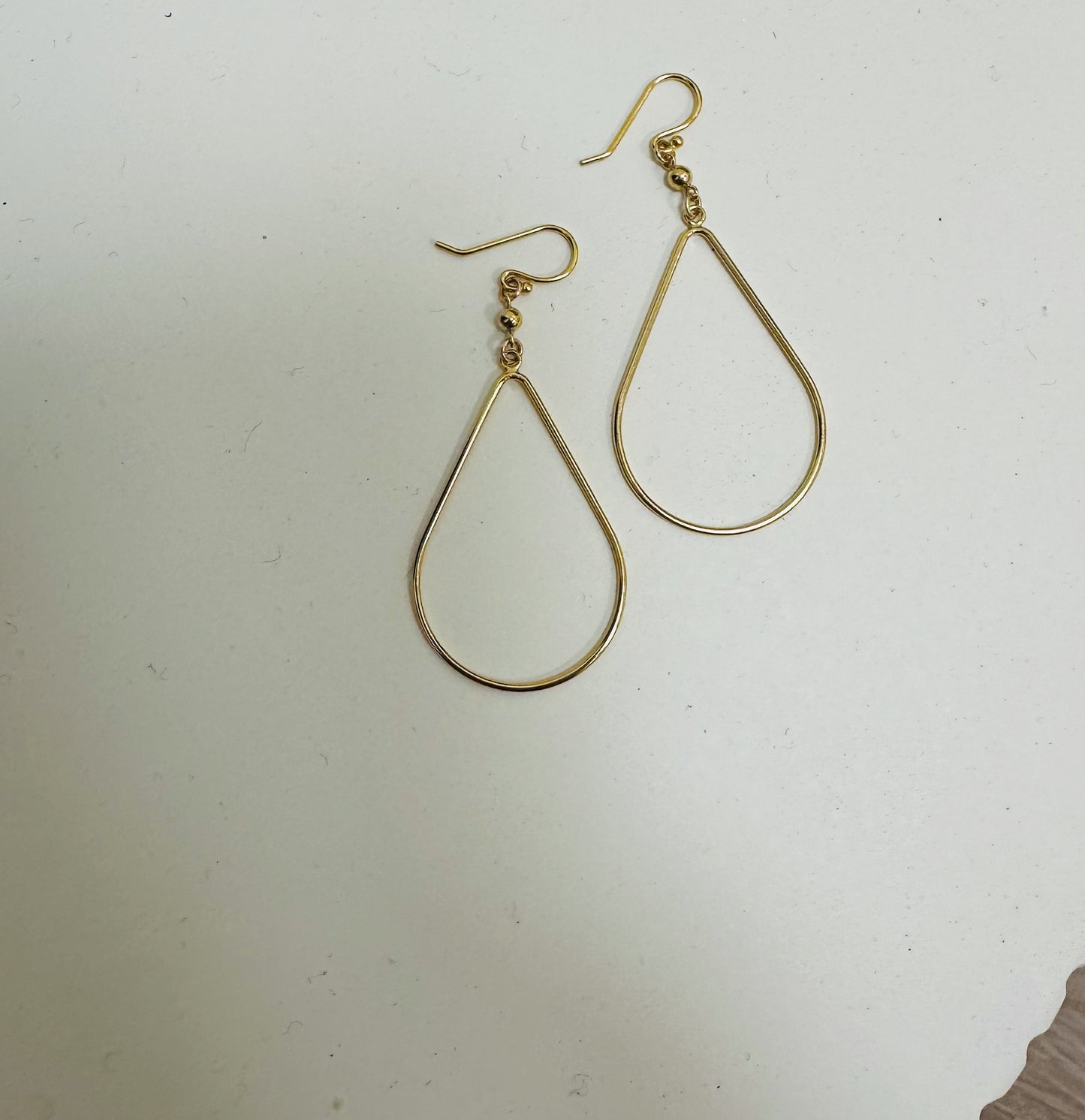 14K gold filled teardrop earrings polished modern silhouette close up